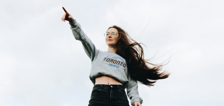 woman pointing using her right hand